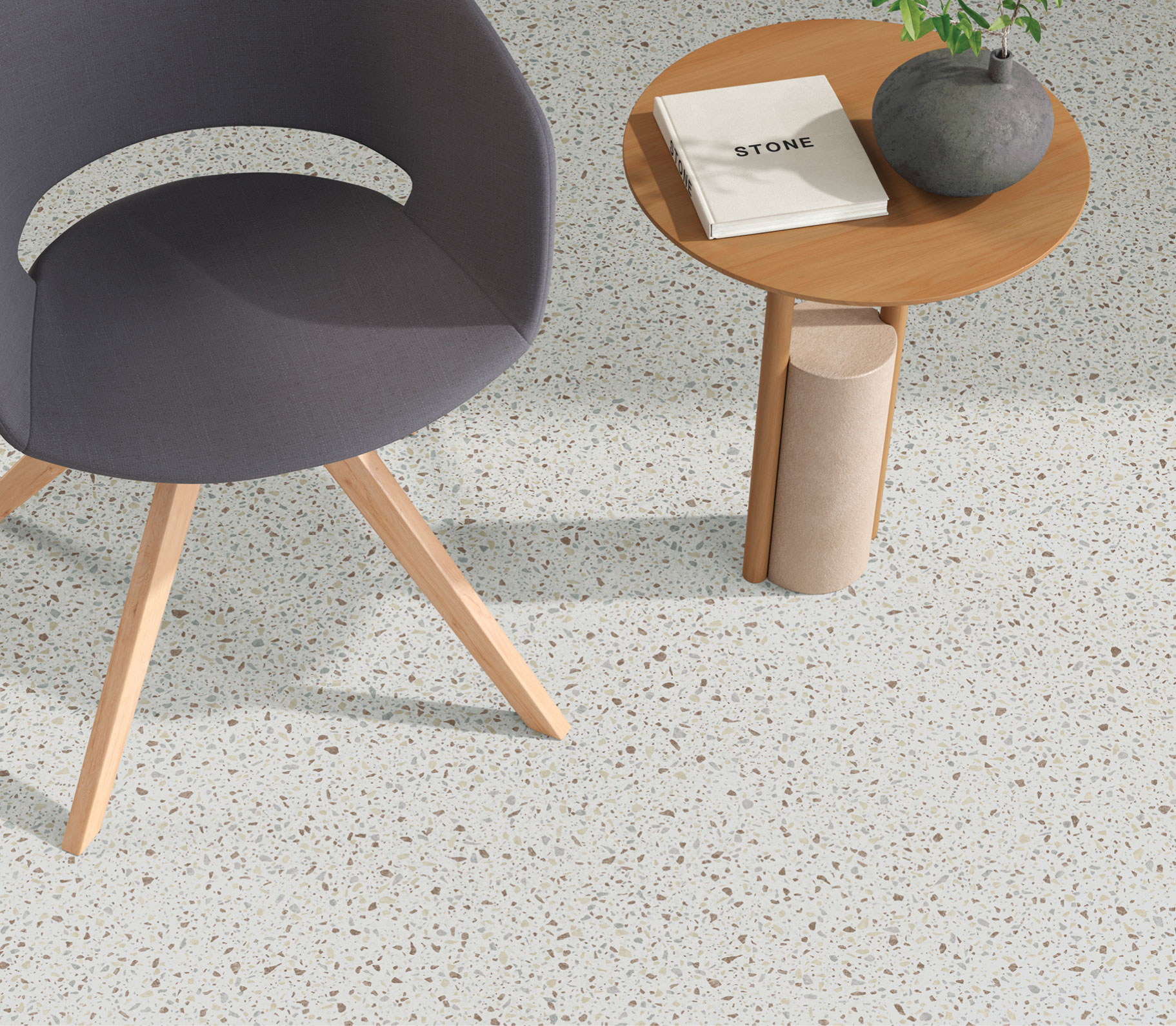 An overhead image of a chair and table on Mix + Mason resilient flooring.