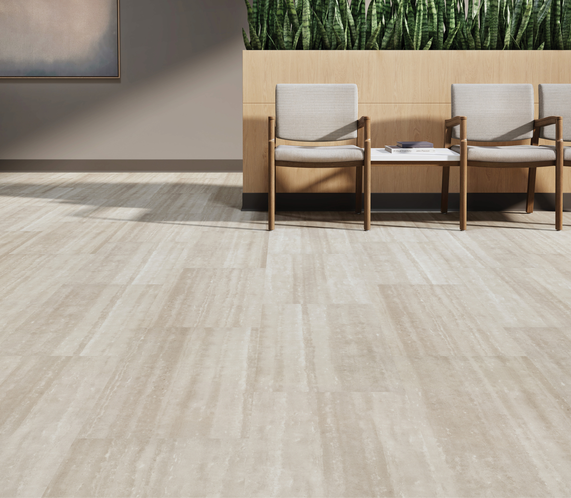 An image of a waiting area with two chairs and Slab + Stone resilient flooring.